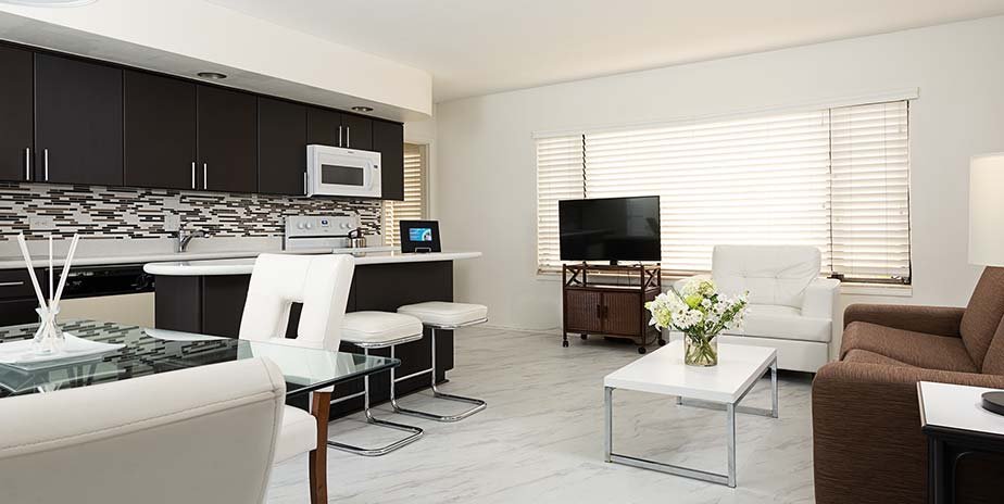 Sunlit guest room at Driftwood Beach Club with warm coastal decor